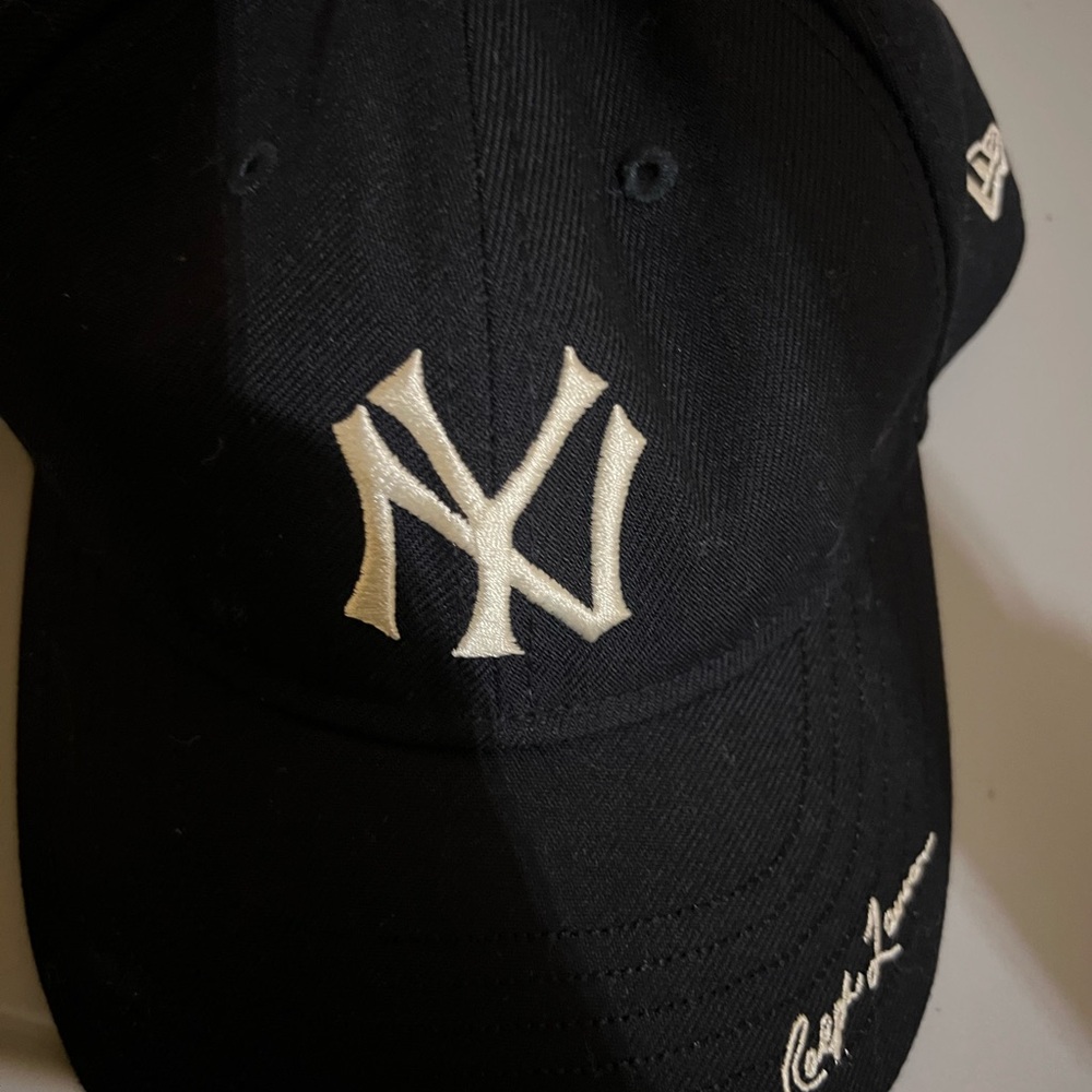 New Era Black Cap with Embroidered Logo